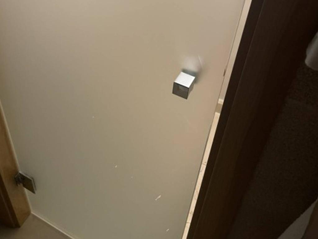 The offending toilet door did little for privacy.