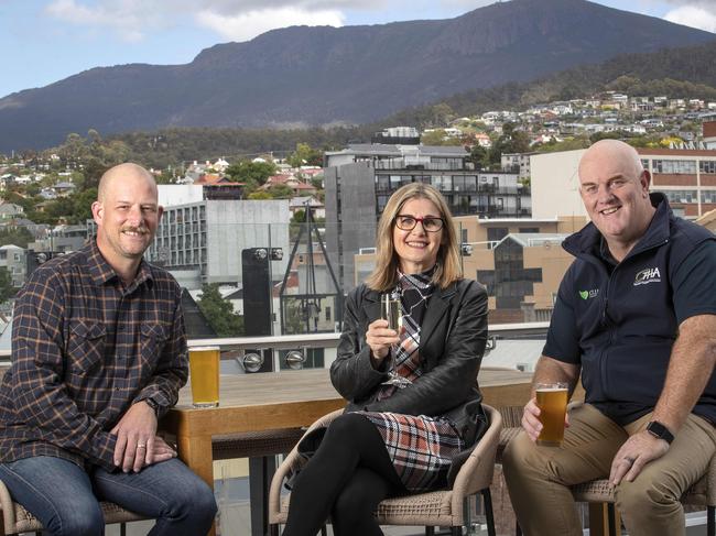 Suzie Luck’s owner Kif Weber, Crowne Plaza Hobart general manager Linda Collins and Tasmanian Hospitality Association CEO Steve Old on The Deck at Crowne Plaza Hobart. Picture: Chris Kidd