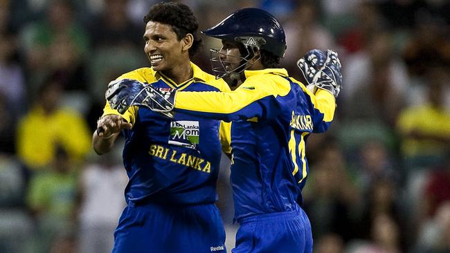 Suraj Randiv celebrates with Kumar Sangakkara after dismissing Brad Haddin.