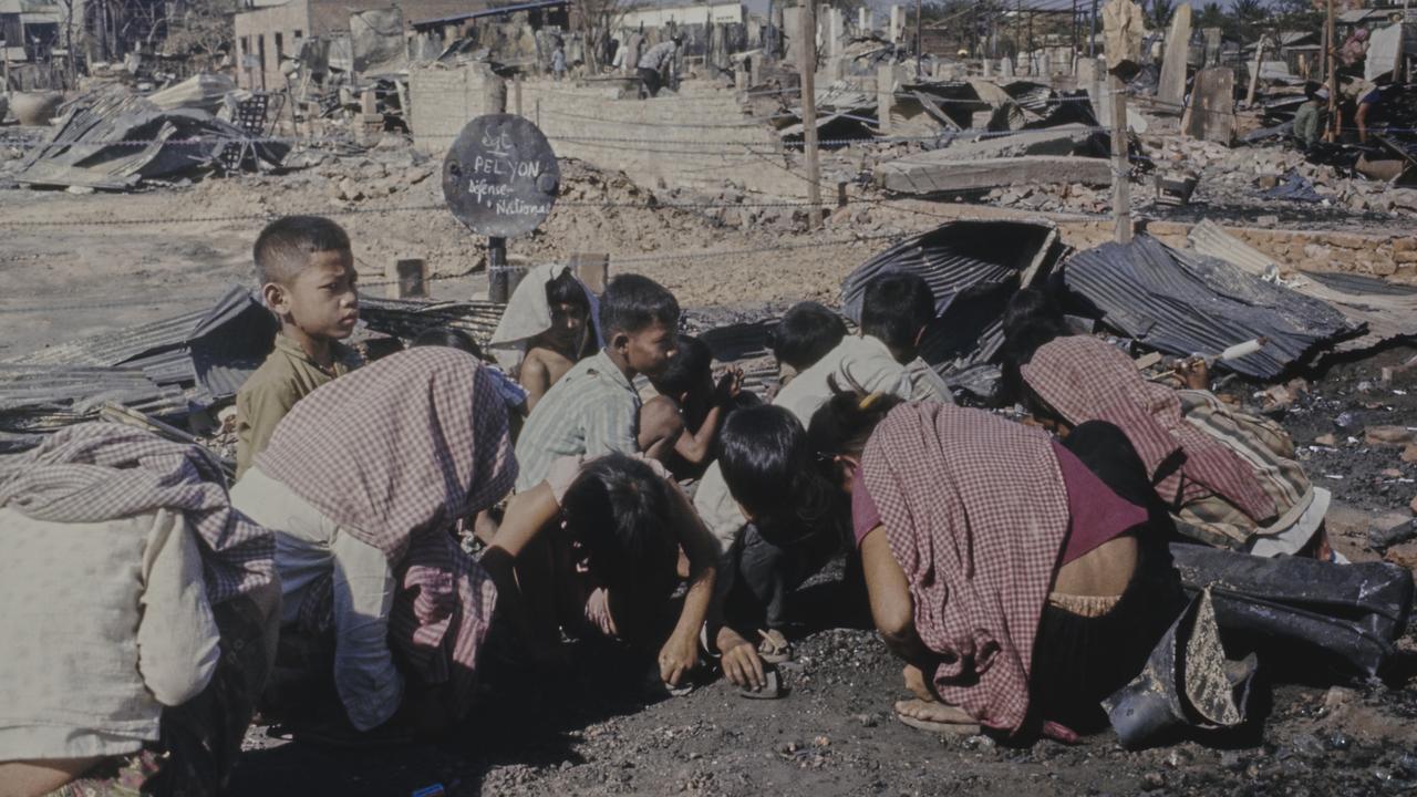 Children scavenge amidst the ruins in Phnom Penh, Cambodia, on February 11th, 1975. The report on Cambodia published in the Daily Mirror prompted a significant public response, raising $45 million for relief efforts, including lifesaving medicines and clothing for Cambodia. Picture: Getty Images