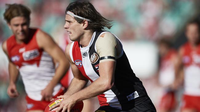 Hunter Clark of St Kilda runs the ball during the round 23 AFL match between the Sydney Swans and the St Kilda Saints.