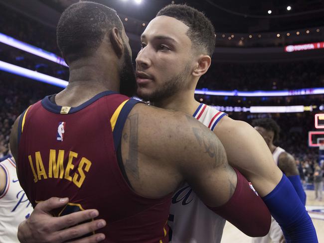 PHILADELPHIA, PA - APRIL 6: LeBron James #23 of the Cleveland Cavaliers hugs Ben Simmons #25 of the Philadelphia 76ers after the game at the Wells Fargo Center on April 6, 2018 in Philadelphia, Pennsylvania. The 76ers defeated the Cavaliers 132-130. NOTE TO USER: User expressly acknowledges and agrees that, by downloading and or using this photograph, User is consenting to the terms and conditions of the Getty Images License Agreement.   Mitchell Leff/Getty Images/AFP == FOR NEWSPAPERS, INTERNET, TELCOS & TELEVISION USE ONLY ==