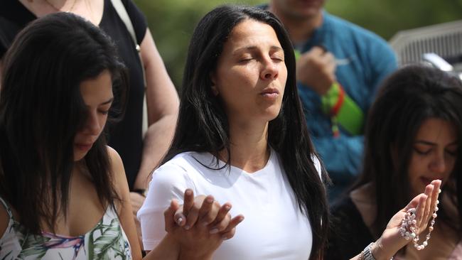 Leila Abdallah, who lost four children, returns to the site to pray. Picture John Grainger