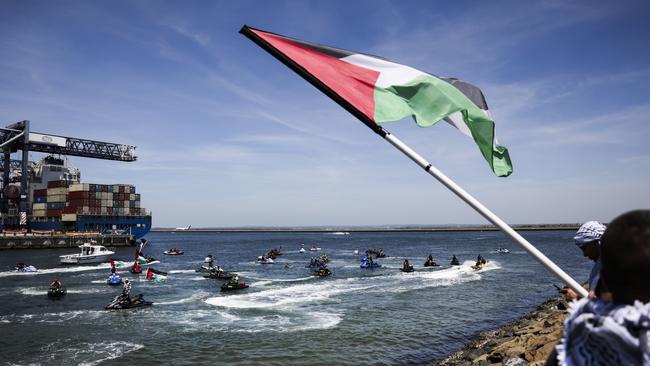 SYDNEY, AUSTRALIA. NCA NewsWire Photos. NOVEMBER 11TH, 2023. Jetskis with Palestinian flags during a pro-Palestine protest to attempt to block an Israel ZIM Shipping boat takes place at Port Botany foreshore boat ramp today.  Picture: NCA NewsWire/ Dylan Robinson