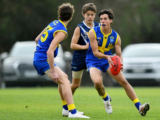 Charlie Montgomery of Frankston District evades a tackle during the South East Region Junior Development Carnival U17 Boys match between Mornington Peninsula and Frankston District at Olympic Park, on June 08, 2024, in Rosebud, Australia. (Photo by Josh Chadwick)