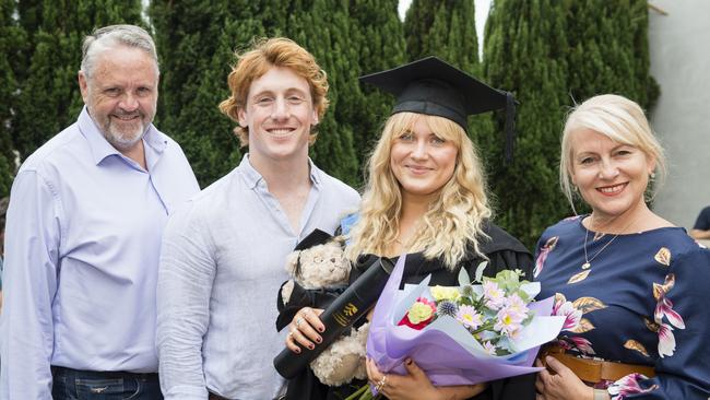 Bachelor of Paramedicine graduate Lily Crombie with (from left) Greg Bulluss, Jacob Reid and Nicole Crombie at a UniSQ graduation ceremony at Empire Theatres, Tuesday, February 13, 2024. Picture: Kevin Farmer