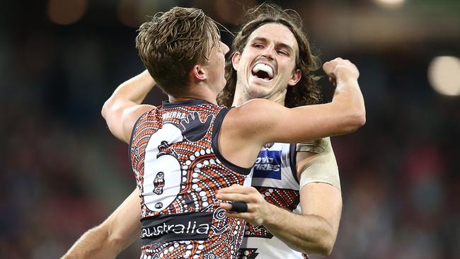 Lachie Whitfield (left) has returned in style after serving his ban. Picture: Getty Images