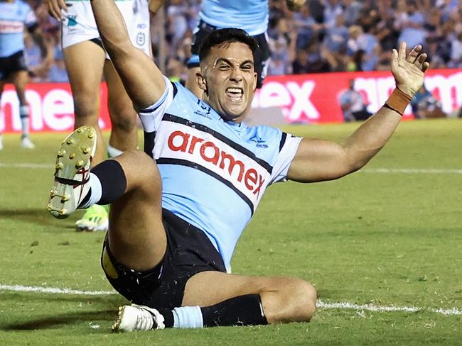 SYDNEY, AUSTRALIA - MARCH 31: Kayal Iro of the Sharks celebrates scoring a try during the round four NRL match between Cronulla Sharks and Canberra Raiders at PointsBet Stadium, on March 31, 2024, in Sydney, Australia. (Photo by Cameron Spencer/Getty Images)