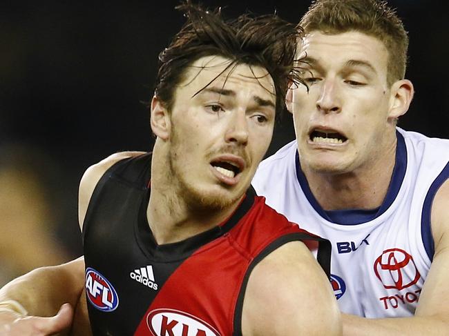 Round 20. Essendon vs Adelaide Crows at Etihad Stadium. Mchael Hibberd gets run down by Josh Jenkins. Pic: Michael Klein