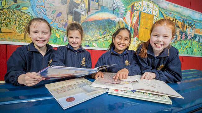 Mt Carmel College students, from left, Jemima Geappen, Georgie Costelloe, Taqdeer Kaur and Isobel Denby enjoying reading. Grade 3 students performed best across all NAPLAN testing areas. Picture: RICHARD JUPE