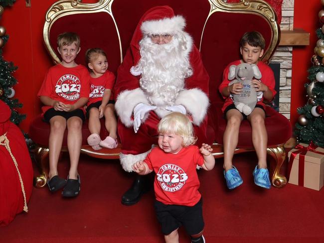 Flynn, Eleanor, Oliver who is holding Alaric (big brother in heaven), and Myles (in the front running away) with Santa: Stockland Rockhampton 2023. Sent in by Otto Mann.