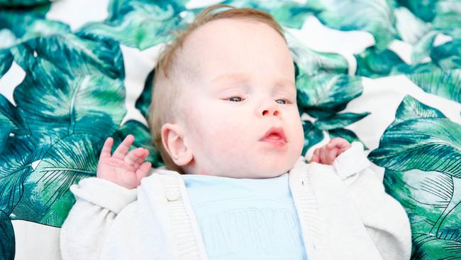 Penguin mother Maddison Murdoch and her sone Lawson Troughton, who at three months old, was given three days to live by doctors. Picture: PATRICK GEE