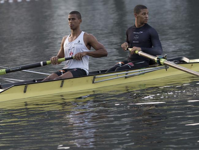 Athletes train in the Rodrigo de Freitas lake in Rio de Janeiro, Brazil, Thursday, July 30, 2015. The lake, which was largely cleaned up in recent years, was thought be safe for rowers and canoers. Yet Associated Press tests found its waters to be among the most polluted for Olympic sites. (AP Photo/Silvia Izquierdo)