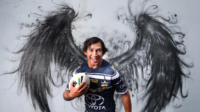 Johnathan Thurston poses in front of graffiti art by BoHDi at Jugglers Art Space in Fortitude Valley. Picture: Annette Dew