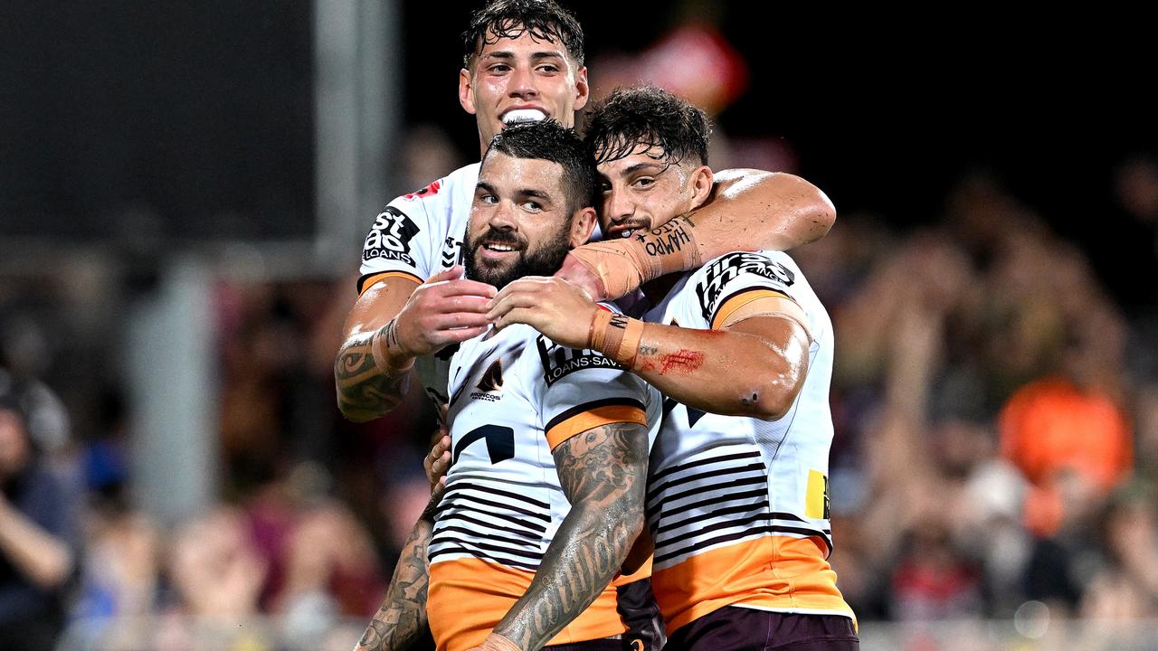 DARWIN, AUSTRALIA - APRIL 21: Adam Reynolds of the Broncos is congratulated by teammates after scoring a try during the round eight NRL match between Parramatta Eels and Brisbane Broncos at TIO Stadium on April 21, 2023 in Darwin, Australia. (Photo by Bradley Kanaris/Getty Images)