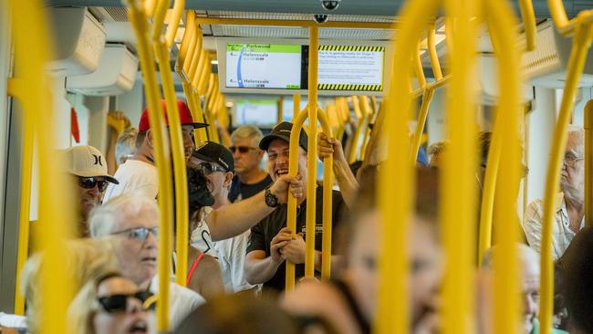 Passengers riding the light rail to Helensvale Station on the opening morning of Stage 2. Photo: Jerad Williams