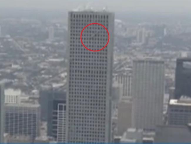 Terrifying ordeal ... the men were left hanging from the side of JPMorgan Chase tower in Houston, Texas for an hour. Picture: KHOU 11 News