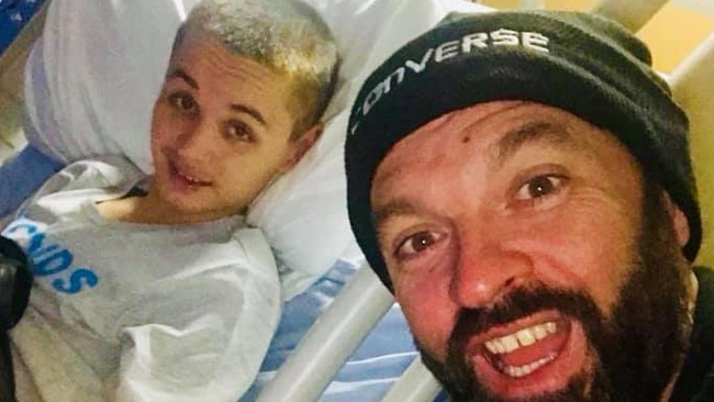 Preston Potter manages a smile as he covers in hospital with dad Gavin Potter. Picture: Facebook