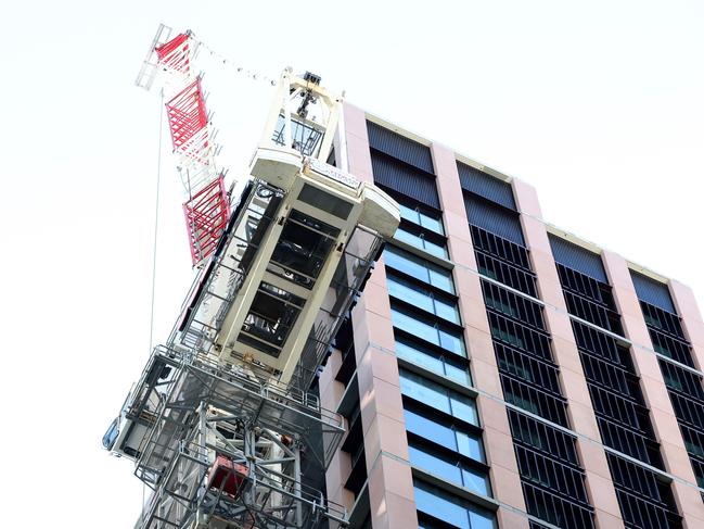 Police said a crane was lifting scaffolding when a rope snapped. Picture: NewsWire / Damian Shaw