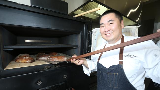 5B2F bakery owner Mr Moonsun Yoo at his wood fired oven. Picture Mike Batterham