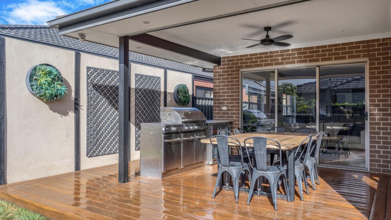 The low-maintenance garden, raised timber entry and sleek facade give this Malcolm Creek-facing Craigieburn property standout street appeal.