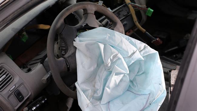 Some car manufacturers are going to wrecking yards to remove dodgy inflators so they don’t end up in another vehicle. Picture: Joe Raedle/Getty Images.