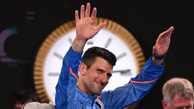 Serbia's Novak Djokovic waves to the crowd as he leaves the court.