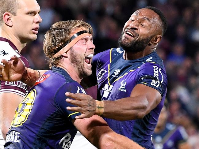 SUNSHINE COAST, AUSTRALIA - SEPTEMBER 10: Christian Welch (L) of the Storm celebrates with Justin Olam of the Storm after scoring a try during the NRL Qualifying Final between the Melbourne Storm and the Manly Warringah Sea Eagles at Sunshine Coast Stadium on September 10, 2021, in Sunshine Coast, Australia. (Photo by Bradley Kanaris/Getty Images)