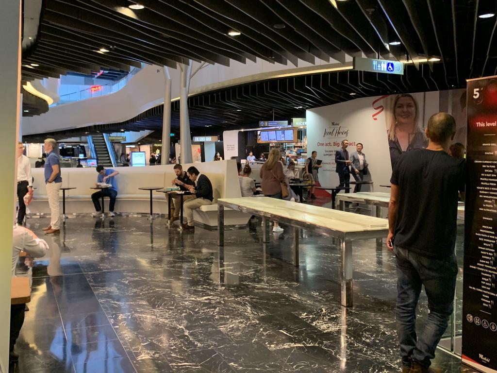 The Westfield Sydney food court still had people sitting inside eating their lunch after the ban came into effect.