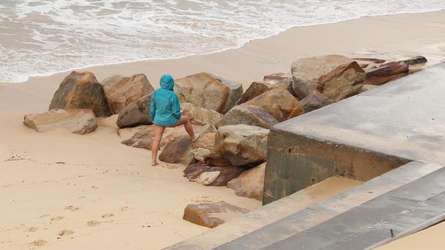 Bigs swells generated by an east coast low uncovered large rocks at the south end of Coogee beach. Picture: John Grainger