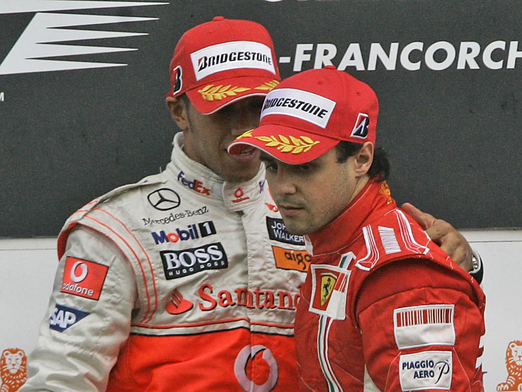 Lewis Hamilton, left, talks to Felipe Massa of Brazil on the podium after the Belgian F1 Grand Prix. AP (Photo: Frank Augstein)