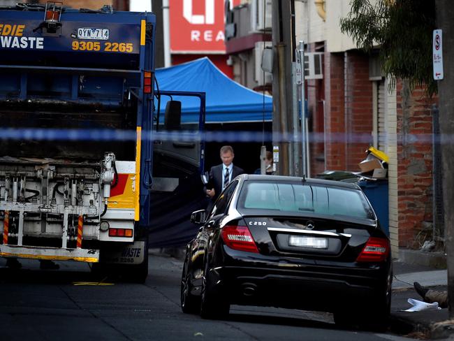 Police examine the murder scene around the body of Joe Acquaro in St Phillip St. Picture: Nicole Garmston