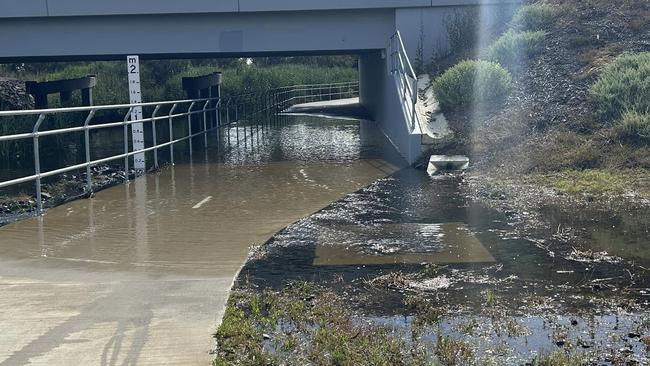 A shared path underneath Barwon Heads Rd, alongside Waurn Ponds Creek, floods after rain in Geelong.