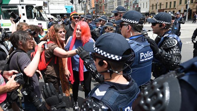 Protesters face off with police during a nation-wide demonstration to protest the Australian government’s treatment of refugees on Manus Island. Picture: AAP Image/Mal Fairclough