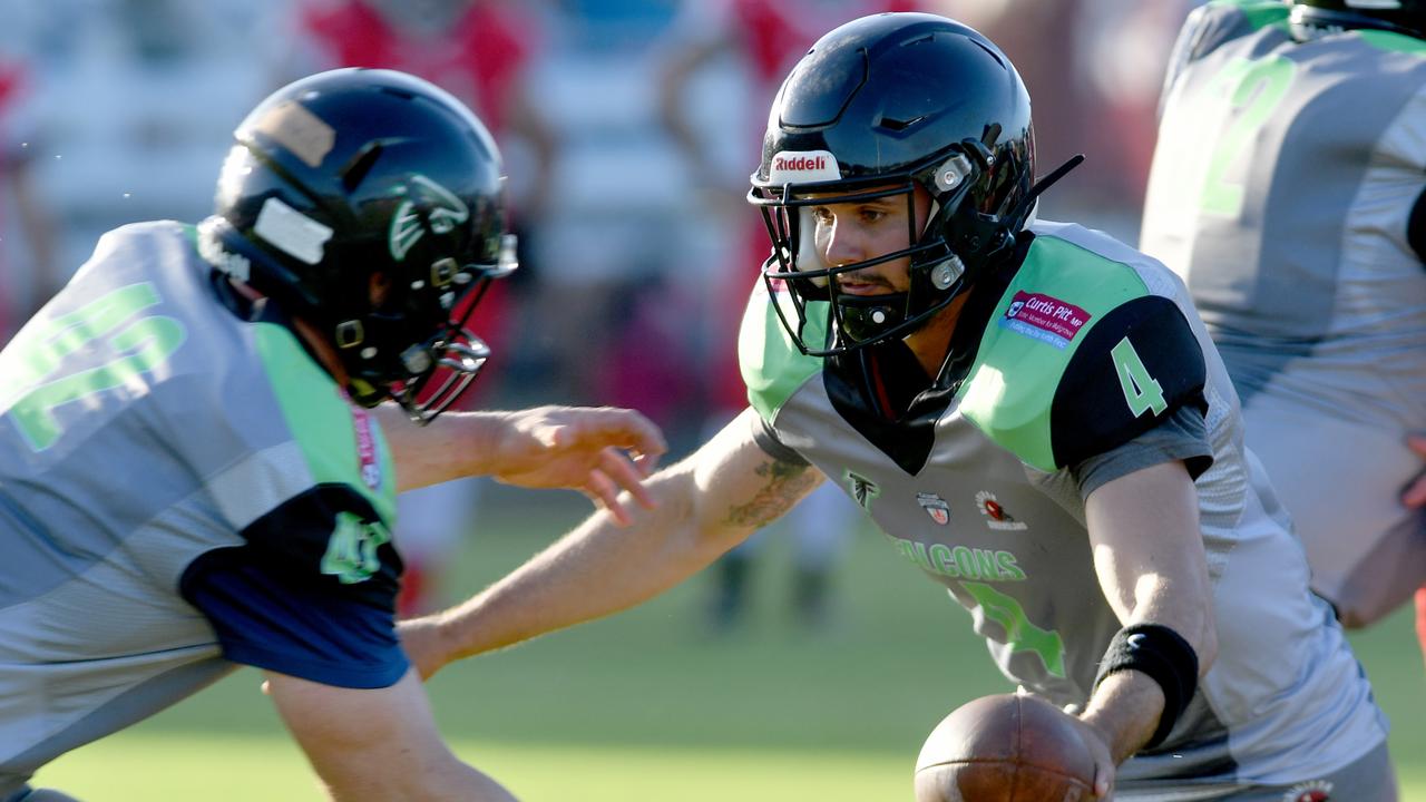 NORTH QUEENSLAND GRIDIRON REEF BOWL 2021. Townsville Cyclones against Cairns Falcons at Townsville Sports Reserve. Falcons Jake Leumann gets ready to take the ball from teammate Brendon Kruger. Picture: Evan Morgan