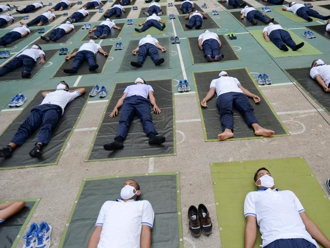 Members of the Bangladesh police attend a yoga session in Dhaka. Picture: AFP