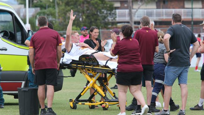 Jon Croad being carried off by paramedics after his shock injury. Pic Mike Batterham