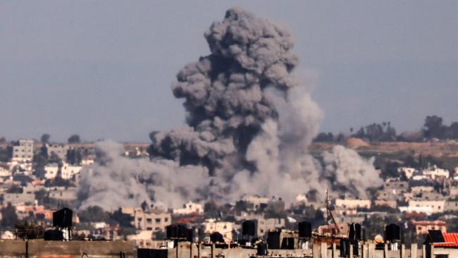 This picture taken from Rafah, in the southern Gaza Strip, shows smoke rising over buildings in Khan Younis during Israeli bombardment on February 1, 2024. Picture: AFP