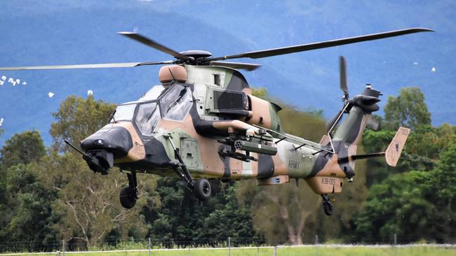 An Australian Army CH-47F Chinook lands next to a MRH90 Taipan from Townsville’s 5th Aviation Regiment and  a Tiger Armed Reconnaissance Helicopter from the 1st Aviation Regiment based in Darwin. Photographs from Exercise Vigilant Scimitar 2022, the 16th Aviation Brigade Foundation War Fighting activity featuring attack helicopters at the Ingham Aerodrome on Sunday. Photograph: Cameron Bates