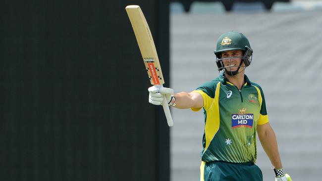 Marsh salutes the crowd after reaching a half century against India.