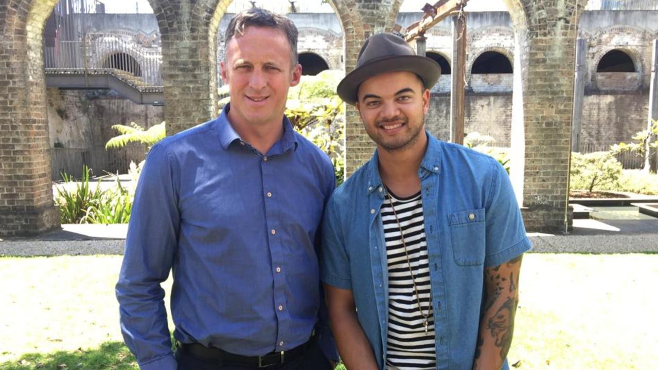 Mr Day with his former client Guy Sebastian.