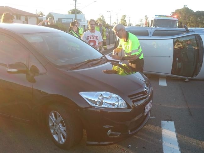 GCB PHOTO Gc hway near matilda service station miami, three cars involved with one rolling PHOTO DAVID CLARK