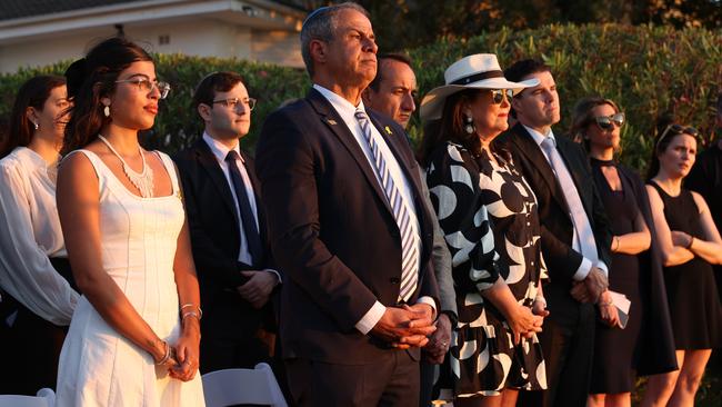 Michal Ohana, left, a survivor of the Nova Music Festival, Israel ambassador Amir Maimon, centre, and Liberal senator Dave Sharma to his left at the Sydney memorial event. Picture: John Feder