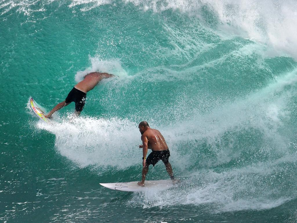 Massive sets are drawing crowds at Kirra on the Gold Coast. Picture: Darren England/AAP