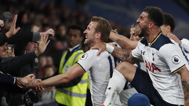 Tottenham players celebrate with their fans after Tottenham's Christian Eriksen scored.