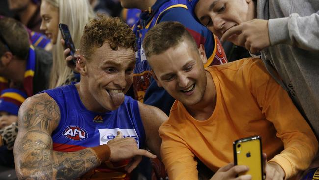 Lions hard man Mitch Robinson gets a selfie with fans. Picture: AAP