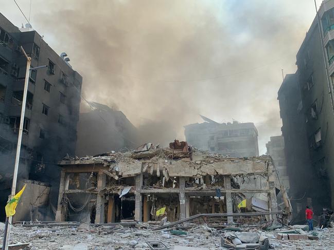 A man inspects the debris and damage at the site of overnight Israeli air strikes that targeted Beirut's southern suburb of Hadath on October 27. Picture: AFP