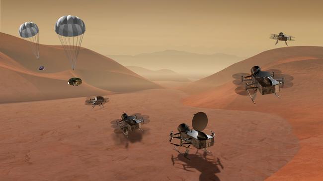 An artist's rendering of multiple views of the Dragonfly dual-quadcopter lander. Picture: NASA via AP