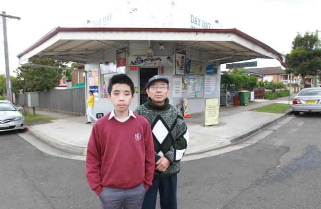 William Nguyen 14, and his dad Bahu in 2013. William fended off two assailants who were robbing his father’s corner shop in Thomas St Parramatta.