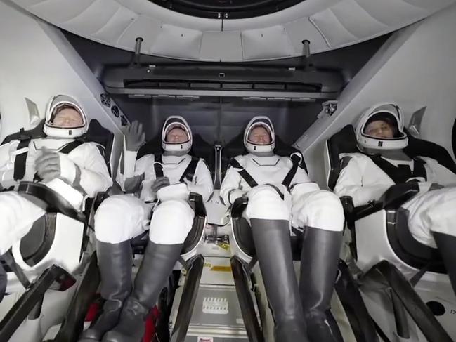 Butch Wilmore, Alexander Gorbunov, Nick Hague, and Suni Williams wait to exit the SpaceX capsule after splashing down. Picture: SpaceX via AP